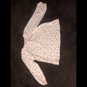 A cream dress shirt with multicolor stars.